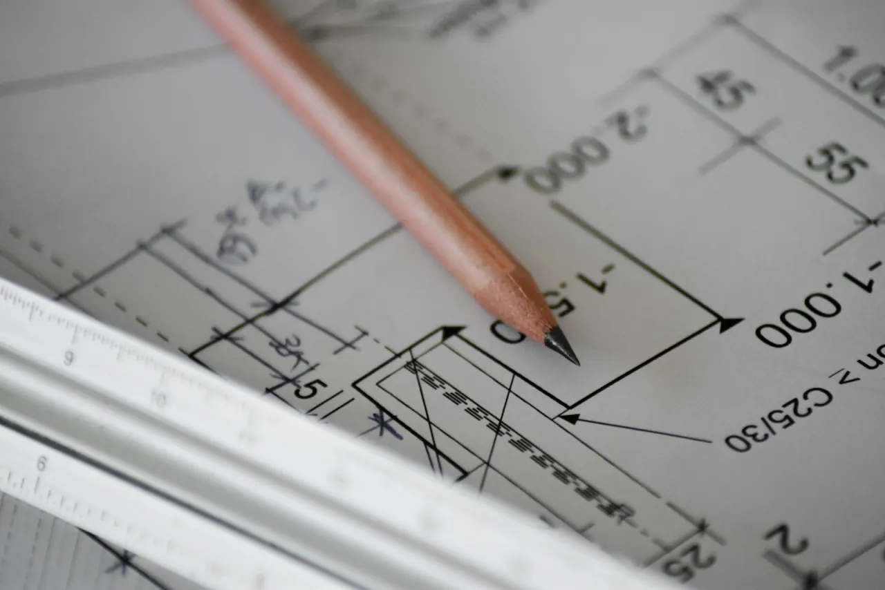 A hotel plan with a scale rule across it